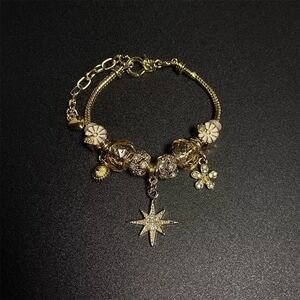 Dazzling Gold Star Charm Bracelet